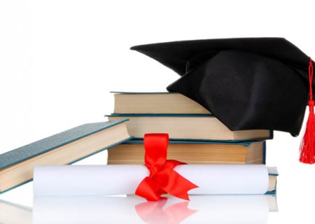 Grad hat with diploma and books isolated on white